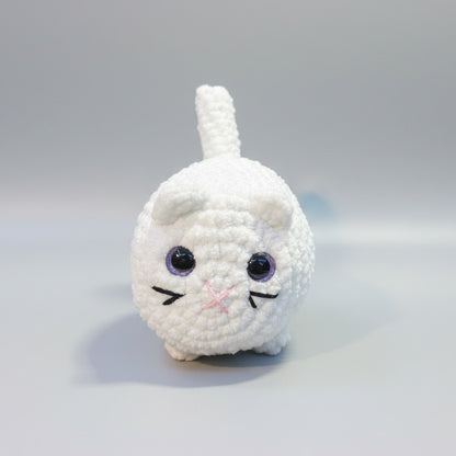 White crochet cat toy on a gray background